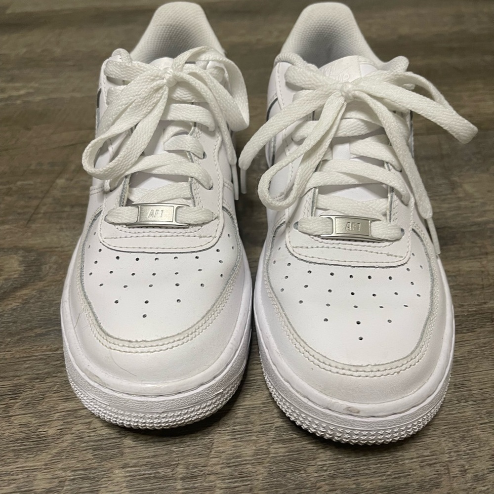 White Nike Air forces. Size 5.5 grade School.